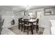 Eat-in kitchen features updated lighting, cabinetry and marble tile flooring at 8151 S Marshall Ct, Littleton, CO 80128