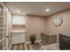 Home office featuring wood-look flooring, storage cabinets, and neutral wall colors at 8151 S Marshall Ct, Littleton, CO 80128