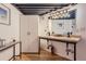 Bathroom with double sinks, modern lighting, and spacious vanity at 1000 E 18Th Ave # 107, Denver, CO 80218