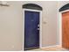 Hallway featuring dark blue unit door with a fish decoration and apartment number at 1000 E 18Th Ave # 107, Denver, CO 80218