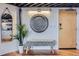 Inviting foyer area with decorative wall art and a comfortable bench at 1000 E 18Th Ave # 107, Denver, CO 80218