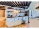 Modern kitchen featuring stainless steel appliances, open shelving, and light countertops at 1000 E 18Th Ave # 107, Denver, CO 80218