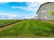 Spacious backyard with lush green lawn and open views at 42425 Forest Oaks Dr, Elizabeth, CO 80107