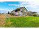 Well-maintained backyard featuring lush green grass and low-maintenance landscaping at 42425 Forest Oaks Dr, Elizabeth, CO 80107