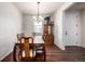 Traditional dining room featuring hardwood floors and an elegant chandelier, creating a warm atmosphere at 42425 Forest Oaks Dr, Elizabeth, CO 80107