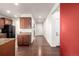 Open concept home with updated brown kitchen cabinets and a hallway with access to a front door at 42425 Forest Oaks Dr, Elizabeth, CO 80107