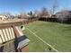 Large, green backyard with a well-maintained lawn and a wood fence, ideal for outdoor activities at 1592 S Memphis St, Aurora, CO 80017