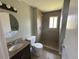 This bathroom features a tiled shower, a granite-topped vanity, and tiled flooring at 1592 S Memphis St, Aurora, CO 80017