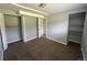 Bedroom features neutral carpet, gray walls, and closet, offering storage space at 1592 S Memphis St, Aurora, CO 80017