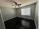 Relaxing bedroom featuring neutral paint, dark wood floors, and natural light at 1592 S Memphis St, Aurora, CO 80017