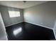 Comfortable bedroom with dark wood flooring, neutral walls, and lots of natural light at 1592 S Memphis St, Aurora, CO 80017