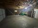 Spacious garage features unfinished walls, concrete floor, providing ample room for parking and storage at 1592 S Memphis St, Aurora, CO 80017