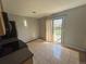 Eat-in kitchen featuring tile flooring, stainless steel appliances, and sliding door to the backyard at 1592 S Memphis St, Aurora, CO 80017