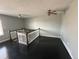 Inviting living room featuring a ceiling fan, dark wood flooring, and light-gray colored walls at 1592 S Memphis St, Aurora, CO 80017