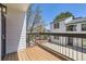 Relaxing balcony overlooking neighborhood views and a tree, offering a tranquil outdoor space at 2120 W 31St Ave, Denver, CO 80211