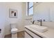 Stylish half bathroom features modern sink, floating vanity, and contemporary design at 2120 W 31St Ave, Denver, CO 80211