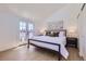 Bright bedroom with ample natural light, doors to a balcony, and neutral decor at 2120 W 31St Ave, Denver, CO 80211