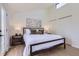 Bright bedroom with ample natural light, a modern bed, and neutral decor at 2120 W 31St Ave, Denver, CO 80211