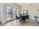 Cozy dining area with stylish seating, modern light fixture, and access to a balcony, perfect for entertaining at 2120 W 31St Ave, Denver, CO 80211