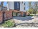 Exterior garage access features a driveway, brick facade, and a modern design at 2120 W 31St Ave, Denver, CO 80211