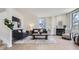 Bright living room featuring hardwood floors, modern decor, and a cozy fireplace, creating an inviting atmosphere at 2120 W 31St Ave, Denver, CO 80211