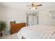 Light-filled primary bedroom with a ceiling fan and a decorative dresser at 8811 Meade St, Westminster, CO 80031