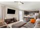 Spacious living area showcasing modern design and seamless transition to the kitchen and dining area at 8811 Meade St, Westminster, CO 80031