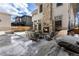 Backyard oasis with an outdoor fireplace, patio seating, and built-in grill for perfect outdoor entertaining at 2486 S Monroe St, Denver, CO 80210