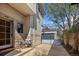 Charming home exterior featuring stone accents, a cozy bench, and a well-maintained yard with a gate at 2486 S Monroe St, Denver, CO 80210