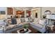 The living room showcases stylish decor and an open layout leading to a kitchen at 2486 S Monroe St, Denver, CO 80210
