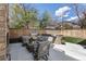 Inviting outdoor patio with comfortable seating, a built-in grill, and a well-manicured lawn, perfect for entertaining at 2486 S Monroe St, Denver, CO 80210