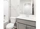 Bright bathroom with gray vanity, modern fixtures, with tub, and mirror at 763 N Tibet St, Aurora, CO 80018
