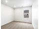 Neutral bedroom with carpet, window, and clean finishes at 763 N Tibet St, Aurora, CO 80018
