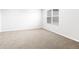 A cozy bedroom features neutral carpet, light gray walls and natural light at 763 N Tibet St, Aurora, CO 80018