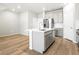 Open-concept kitchen with stainless steel appliances and a large island for easy meal preparation and entertaining at 763 N Tibet St, Aurora, CO 80018