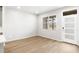 Bright living room featuring wood floors and a modern entryway door at 763 N Tibet St, Aurora, CO 80018