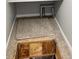 Carpeted room with a trapdoor covering a potential storage area at 763 N Tibet St, Aurora, CO 80018