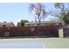 Community basketball court surrounded by landscaping and townhome residences at 155 Xenon St # 33, Denver, CO 80228
