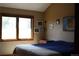 Cozy bedroom with a large window and warm natural light at 155 Xenon St # 33, Denver, CO 80228