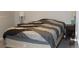 Bedroom featuring a comfortable bed with a modern duvet cover and side tables at 155 Xenon St # 33, Denver, CO 80228