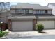 Two-story home with an attached two-car garage and a well-maintained front yard at 155 Xenon St # 33, Denver, CO 80228