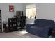 Living room with a sofa, a gaming setup, and a window with natural light at 155 Xenon St # 33, Denver, CO 80228