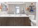 Spacious bathroom with double sinks, a large mirror, and stylish decor creating a serene atmosphere at 8405 Pebble Creek Way # 202, Highlands Ranch, CO 80126