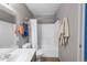 Well-lit bathroom featuring a tub-shower combo, modern fixtures, and ample storage for toiletries and linens at 8405 Pebble Creek Way # 202, Highlands Ranch, CO 80126