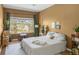 Bright bedroom with a play area and view of the landscape at 8405 Pebble Creek Way # 202, Highlands Ranch, CO 80126