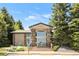 Well-maintained clubhouse with stone accents and lush landscaping is ideal for community gatherings at 8405 Pebble Creek Way # 202, Highlands Ranch, CO 80126
