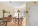 Bright dining area with natural light, classic wooden furniture, and a charming pendant light fixture, perfect for gatherings at 8405 Pebble Creek Way # 202, Highlands Ranch, CO 80126