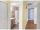 Hallway view of the bathroom and bedroom at 8405 Pebble Creek Way # 202, Highlands Ranch, CO 80126