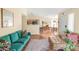 Open-concept living space with a view of the kitchen, dining area, and stylish furniture, creating a welcoming atmosphere at 8405 Pebble Creek Way # 202, Highlands Ranch, CO 80126