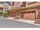 Two car garage with stone cladding on a new home at 10152 Inverness Main St, Englewood, CO 80112